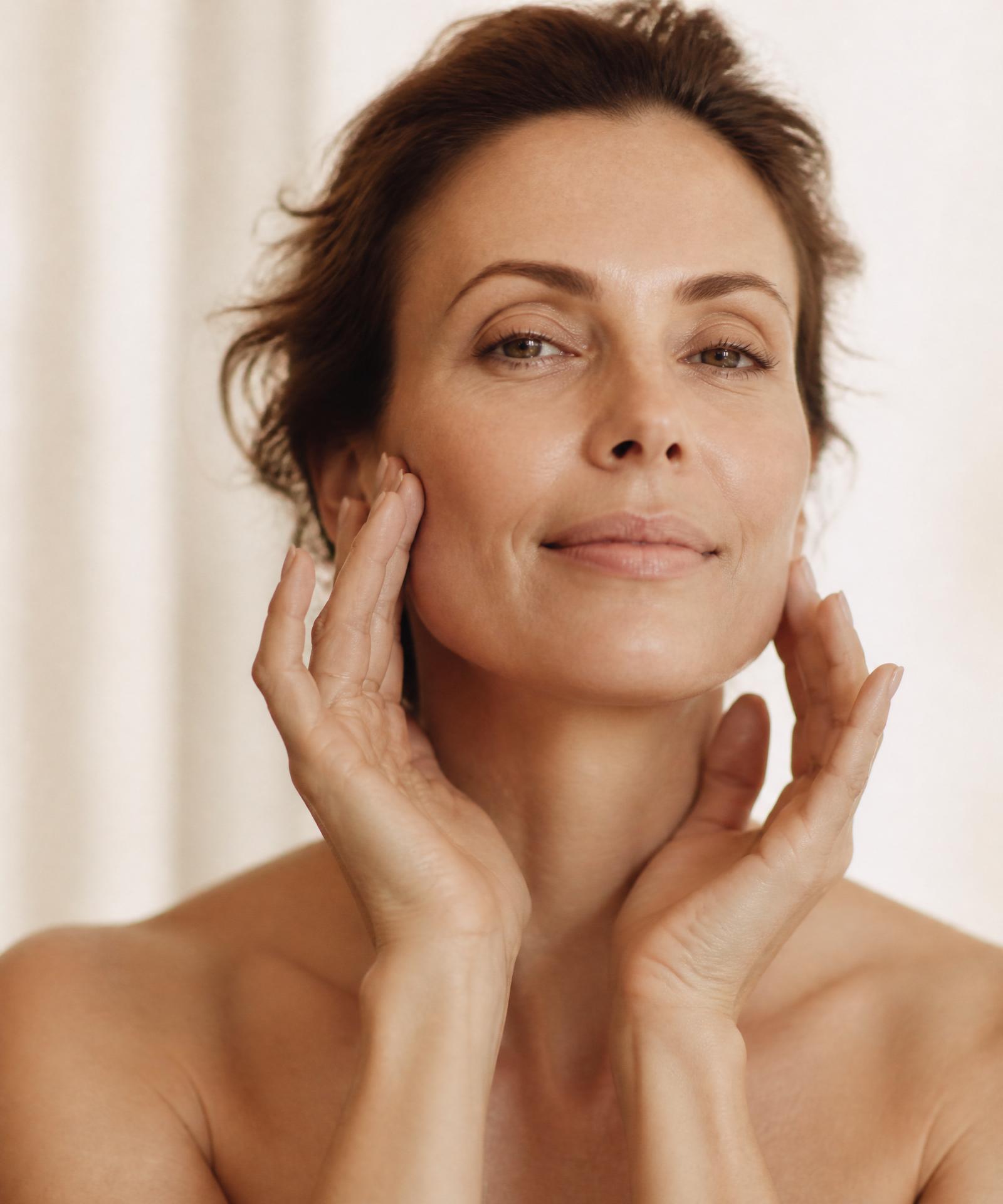 Woman practicing face yoga with a serene expression
